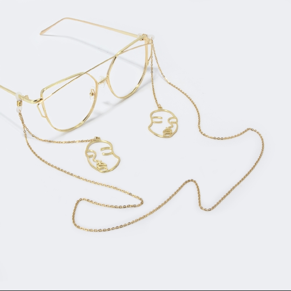 Abstract Golden Colored Human Faces Glasses Chain